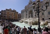 Tourists admire the Trevi Fountain in Rome, on June 7, 2017. (AP Photo/Gregorio Borgia, File)