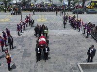 Keiko Fujimori, her brother Kenji, and other relatives follow pallbearers carrying the coffin of their father, former President Alberto Fujimori, to a museum for his wake in Lima, Peru, on Sept. 12, 2024. (AP Photo/Guadalupe Pardo)