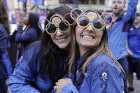 Volunteers of Paris 2024 Olympics and French athletes who participated in the 2024 Olympics and Paralympics take part in a parade in front of the Arc de Triomphe monument on the Champs Elysees, on Sept. 14, 2024 in Paris. (Andre Pain/Pool Photo via AP)