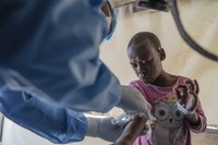 A health worker attends to an mpox patient, at a treatment center in Munigi, eastern Congo, on Aug. 19, 2024. (AP Photo/Moses Sawasawa, File)