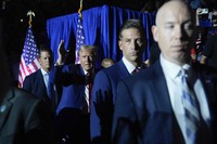 Republican presidential candidate former President Donald Trump, center, gestures as he is introduced for a town hall event at the Dort Financial Center, on Sept. 17, 2024, in Flint, Mich. (AP Photo/Evan Vucci)