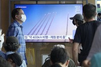 A TV screen shows a file image of a North Korean missile launch during a news program at Seoul Railway Station in Seoul, South Korea, on Sept. 18, 2024. (AP Photo/Ahn Young-joon)