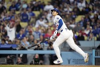 Los Angeles Dodgers designated hitter Shohei Ohtani heads to first after hitting a two-run home run during the third inning of a baseball game against the Cincinnati Reds on May 17, 2024, in Los Angeles. (AP Photo/Mark J. Terrill)