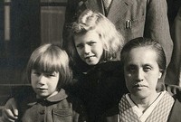 Dacia Maraini, center, is pictured as a girl after World War II, in this photo provided by the Hokkaido University Archives.