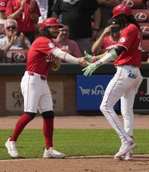Cincinnati Reds' Elly De La Cruz, right, celebrates after his three-run home run with Jonathan India, left, during the fourth inning of a baseball game against the Pittsburgh Pirates, on Sept. 21, 2024, in Cincinnati. (AP Photo/Carolyn Kaster)