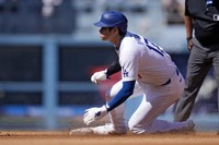 Los Angeles Dodgers' Shohei Ohtani steals second during the third inning of a baseball game against the Colorado Rockies, on Sept. 22, 2024, in Los Angeles. (AP Photo/Mark J. Terrill)
