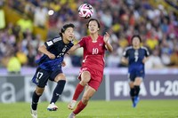 Japan's Uno Shiragaki, left, and North Korea's Pak Mi Ryong battle for the ball during the U-20 Women's World Cup final soccer match at El Campin stadium in Bogota, Colombia, on Sept. 22, 2024. (AP Photo/Fernando Vergara)