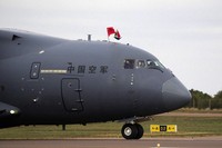 China's Y-20 transport aircraft pilot and crew wave during the Africa Aerospace and Defence Exhibition (AAD) at Waterkloof Air Force Base in Pretoria, South Africa, on Sept. 22, 2024. (AP Photo/Themba Hadebe)