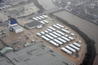 Temporary housing units, center, are seen flooded after the Kawarada River burst its banks, on Sept. 21, 2024, in Wajima, Ishikawa Prefecture. (Mainichi/Tadashi Kako)