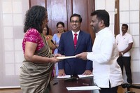 National People's Power lawmaker Harini Amarasuriya, 54, left, takes the oath for the post of Sri Lanka's Prime Minister in front of President Anura Kumara Dissanayake, in Colombo, Sri Lanka, on Sept. 23, 2024. (Sri Lanka Government Information Department via AP) 