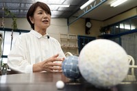 Eiko Araki, a master of the traditional Japanese craft of Sanuki Kagari Temari, talks to The Associated Press at her studio in Kawaramachi, Kagawa Prefecture, on Sept. 5, 2024. (AP Photo/Ayaka McGill)