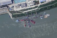 This satellite image from Planet Labs PBC shows what appears to be a sunken Chinese submarine at a shipyard near Wuhan, China, on June 15, 2024. (Planet Labs PBC via AP)