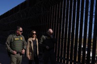 Democratic presidential nominee Vice President Kamala Harris talks with John Modlin, the chief patrol agent for the Tucson Sector of the U.S. Border Patrol, right, and Blaine Bennett, the U.S. Border Patrol Douglas Station border patrol agent in charge, as she visits the U.S. border with Mexico in Douglas, Ariz., on Sept. 27, 2024. (AP Photo/Carolyn Kaster)