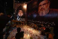 Shiite Muslims light candles during a protest against the killing of Hezbollah leader Hassan Nasrallah, in Karachi, Pakistan, on Sept. 28, 2024. (AP Photo/Fareed Khan)
