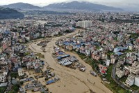 In this aerial image of the Kathmandu valley, the Bagmati River is seen in flood due to heavy rains in Kathmandu, Nepal, on Sept. 28, 2024. (AP Photo/Gopen Rai)