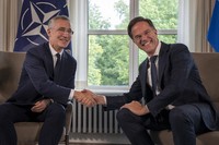 NATO Secretary General Jens Stoltenberg, left, and then-Dutch Prime Minister Mark Rutte shake hands for the cameras prior to a meeting in The Hague, Netherlands, on June 27, 2023. (AP Photo/Peter Dejong, File)