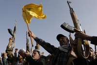 Houthi supporters raise a Hezbollah flag during an anti-Israel and anti-U.S. rally in Sanaa, Yemen, on Sept. 27, 2024. (AP Photo/Osamah Abdulrahman)