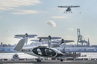 An electric vertical takeoff and landing (eVTOL) aircraft, flies above the Joby eVTOL aircraft, during a demonstration of eVTOLs on Nov. 13, 2023, in New York. (AP Photo/Bebeto Matthews, File)