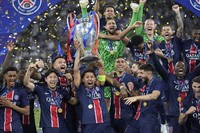 PSG players celebrate with the trophy after winning the Champions League final soccer match between Paris Saint-Germain and Inter Milan at the Allianz Arena in Munich, Germany, on May 31, 2025. (AP Photo/Matthias Schrader)