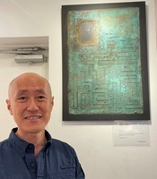 Diplomat and abstract sand artist Takashi Hattori and his work titled 