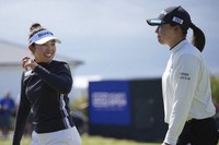 Miyu Yamashita, left, and Rio Takeda both of Japan smile after their second round of the Women's British Open golf championship, at Royal Porthcawl Golf Club in Porthcawl, Wales, Friday, Aug. 1, 2025. (AP Photo/Kin Cheung)