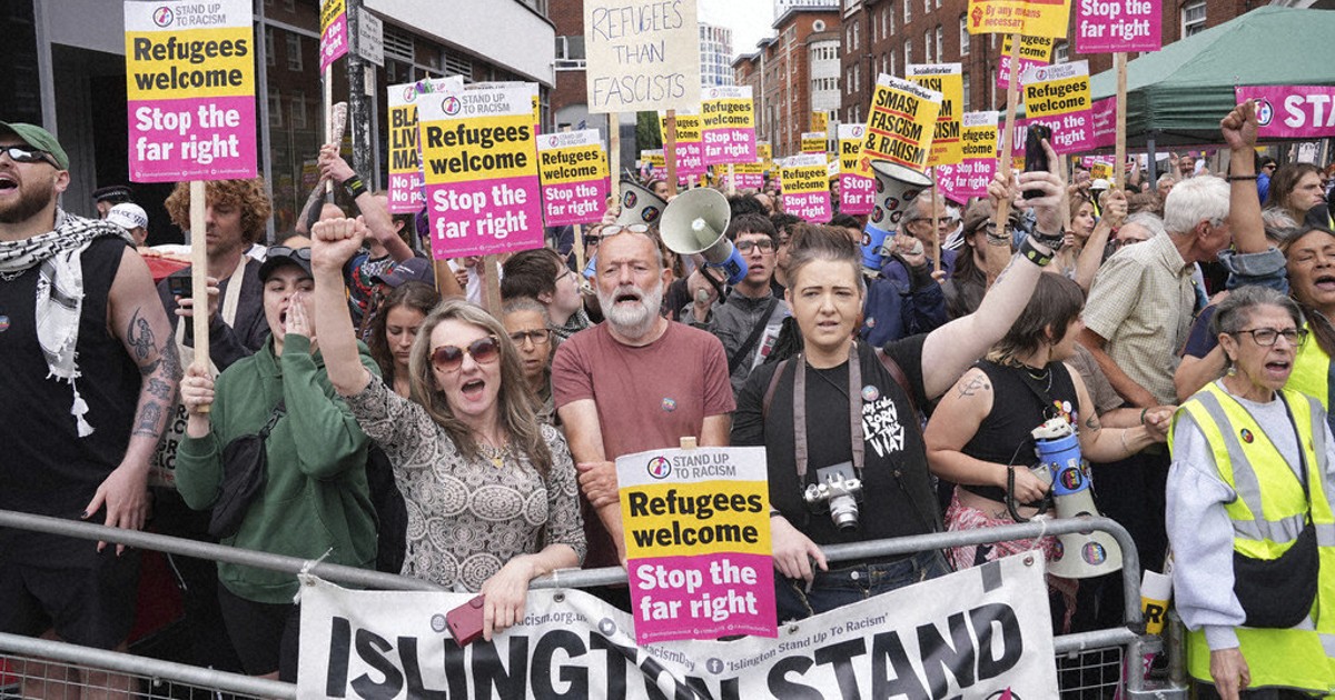 Rival anti-migrant and anti-racism protests face off outside a hotel housing migrants in London