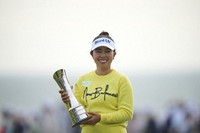 Miyu Yamashita of Japan poses with her trophy after winning the Women's British Open golf championship, at Royal Porthcawl Golf Club in Porthcawl, Wales, on Aug. 3, 2025. (AP Photo/Kin Cheung)