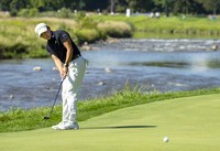 Akie Iwai of Japan, lines up her putt on the 9th hole during the second round of the Canadian Women's Open golf tournament in Mississauga, Ontario, on Aug. 22, 2025. (Frank Gunn/The Canadian Press via AP)