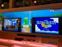 The new "Sushi Quest" game introduced at the Sushiro Futuristic Expo Store is seen on a screen at the store in Osaka's Konohana Ward on Aug. 21, 2025. (Mainichi/Tatsu Shingu)