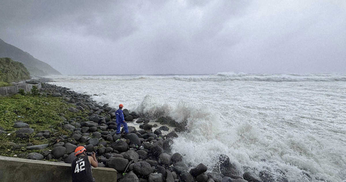 Super typhoon blowing by northern Philippines and Taiwan forces evacuations and closures