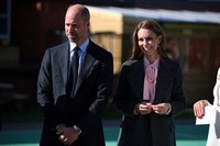Britain's Prince William, left, and Kate, Princess of Wales visit Churchtown Primary School, Southport, England, Sept. 23, 2025. (Phil Noble/Pool Photo via AP)