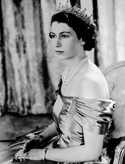 Britain's Queen Elizabeth II, then Princess Elizabeth, wears a silver gown with a diamond tiara and pearl necklace, in the United Kingdom, Aug. 30, 1949. (AP Photo, File)