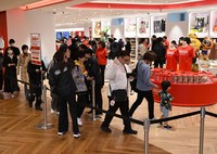 Customers enter Nintendo's Fukuoka store after it opened Nov. 14, 2025. (Mainichi/Tomohisa Yazu)