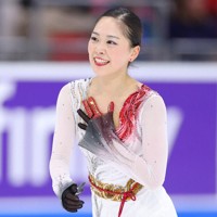 女子フリーの演技を終えて笑顔を見せる吉田陽菜＝米レークプラシッドで2025年11月16日、猪飼健史撮影