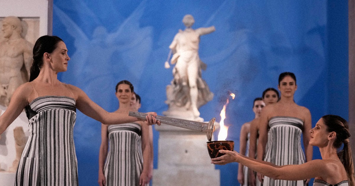 Under a cloud, the Olympic flame begins its journey to the Milan Cortina Winter Olympics