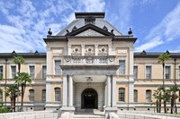 The former main building of the Kyoto Prefectural Government is seen in the city of Kyoto's Kamigyo Ward, Aug. 14, 2023. The structure made of bricks features a large roof with a triangular pediment at its center, flanked by symmetrical wings extending to either side. (Mainichi/Ai Kawahira)