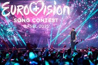  JJ, from Austria, stands on the stage with his trophy after winning the Grand Final of the 69th Eurovision Song Contest in Basel, Switzerland, May 18, 2025. (AP Photo/Martin Meissner, File)