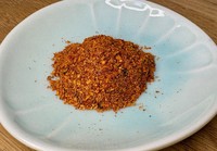 This file photo taken in December 2025 shows "shichimi" mixed red chili powder (or "seven-spice"), which is often used in winter dishes to make people feel warm. However, improper storage during summer may lead to insect contamination, an undesirable "eighth spice." (Mainichi/Tomofumi Inagaki)