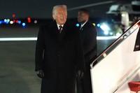 President Donald Trump arrives at Joint Base Andrews, Md., after attending the World Economic Forum in Davos, Jan. 22, 2026. (AP Photo/Evan Vucci)