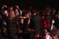 The team from KPop Demon Hunters, seated in the audience, reacts to winning the award for best song written for visual media for "Golden" during the 68th annual Grammy Awards on Feb. 1, 2026, in Los Angeles. (AP Photo/Chris Pizzello) 