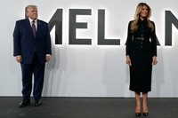 President Donald Trump and first lady Melania Trump arrive for the premiere of her movie "Melania" at The John F. Kennedy Memorial Center for the Performing Arts, on Jan. 29, 2026, in Washington. (AP Photo/Jose Luis Magana)