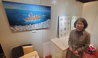 Artist Masae Ito is pictured at her solo exhibition. In her new work "Funade" (Ship departure), she also depicted the former Maeda residence, expressing her wish for its preservation. (Mainichi/Tadahiko Mori)