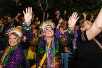 Attendees participate in the annual Krewe of Muses parade during the Mardi Gras season on Feb. 12, 2026, in New Orleans. (Photo by Amy Harris/Invision/AP)