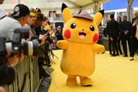 A person in a Pikachu character costume attends the premiere of "Pokemon Detective Pikachu" at Military Island in Times Square, May 2, 2019, in New York. (Photo by Evan Agostini/Invision/AP, File)