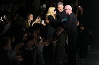 Madonna congratulates Domenico Dolce, right, and Stefano Gabbana at the end of the Dolce & Gabbana Fall/Winter 2026-2027 Women's collection, presented in Milan, Italy, Saturday, Feb. 28, 2026. (AP Photo/Antonio Calanni)
