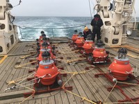 Devices for collecting acoustic data from the seafloor are seen aboard a ship in this photo provided by Tohoku University, Hokkaido University and the Japan Agency for Marine-Earth Science and Technology (JAMSTEC).