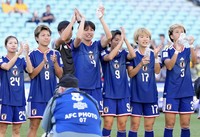 Japan players celebrate after qualifying for the Women's World Cup with their Asian Cup quarterfinal win over the Philippines at Stadium Australia in Sydney on March 15, 2026. (Kyodo) 