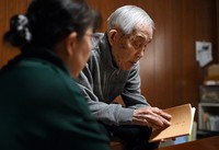 A-bomb survivor Hiromu Morishita, right, holds a copy of one of his works, next to his daughter Chiyuki, in Hiroshima's Saeki Ward on Feb. 25, 2026. (Mainichi/Kenjiro Sato)