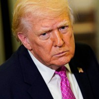 トランプ米大統領＝大統領専用機内で2026年3月29日、ロイター