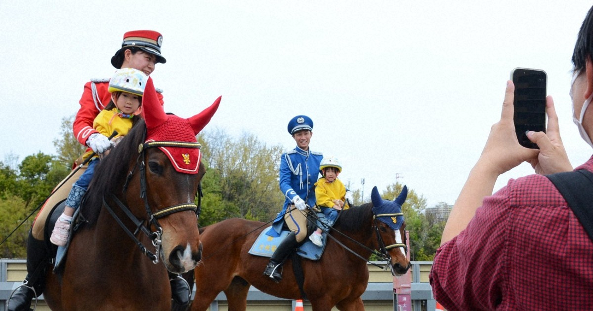 Tokyo's horseback police charm children at safety campaigns